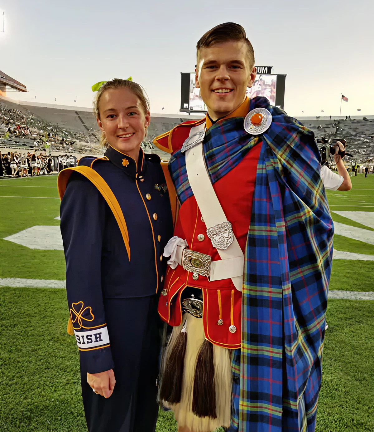 Marching band members in colorful uniforms